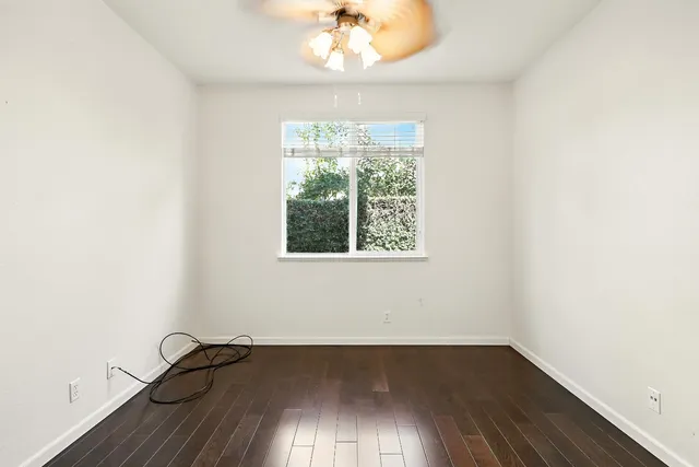 wooden floor with white walls