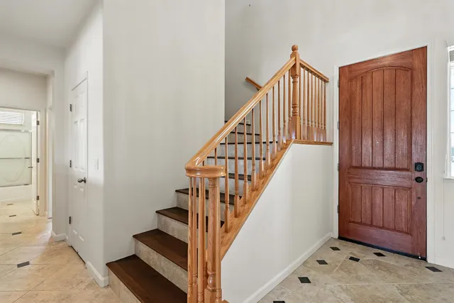 a bedroom with a bed and ceiling fan