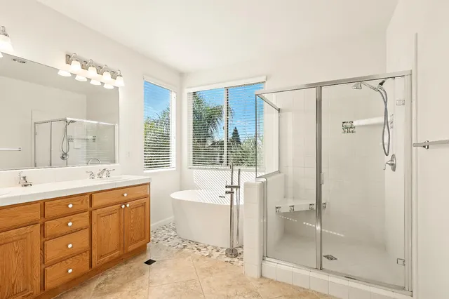 a view of a room with a white wall and a window