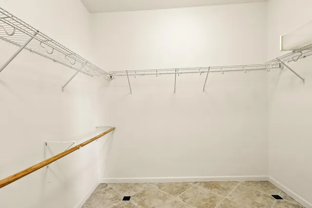 a bathroom with a double vanity sink a mirror and a shower