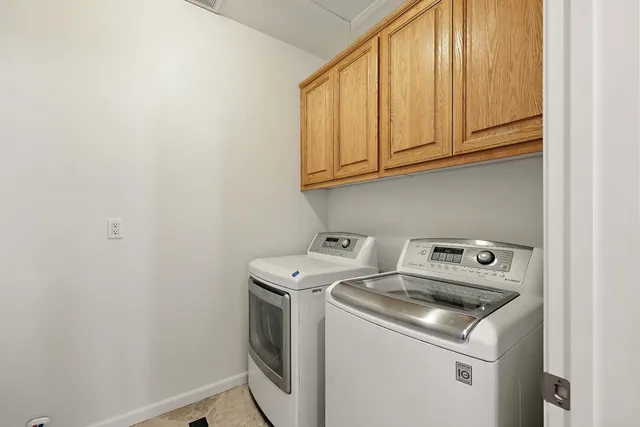 a view of front door and deck with furniture