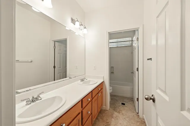 a view of a patio with a table and chairs