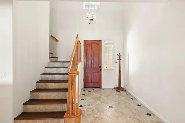 a view of a hallway with staircase