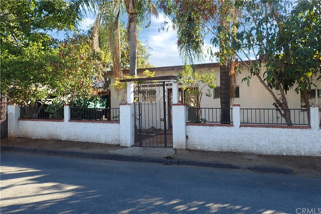 a view of a house with a street