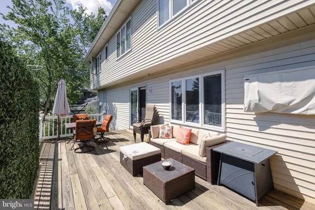 a patio with patio a couch and wooden floor