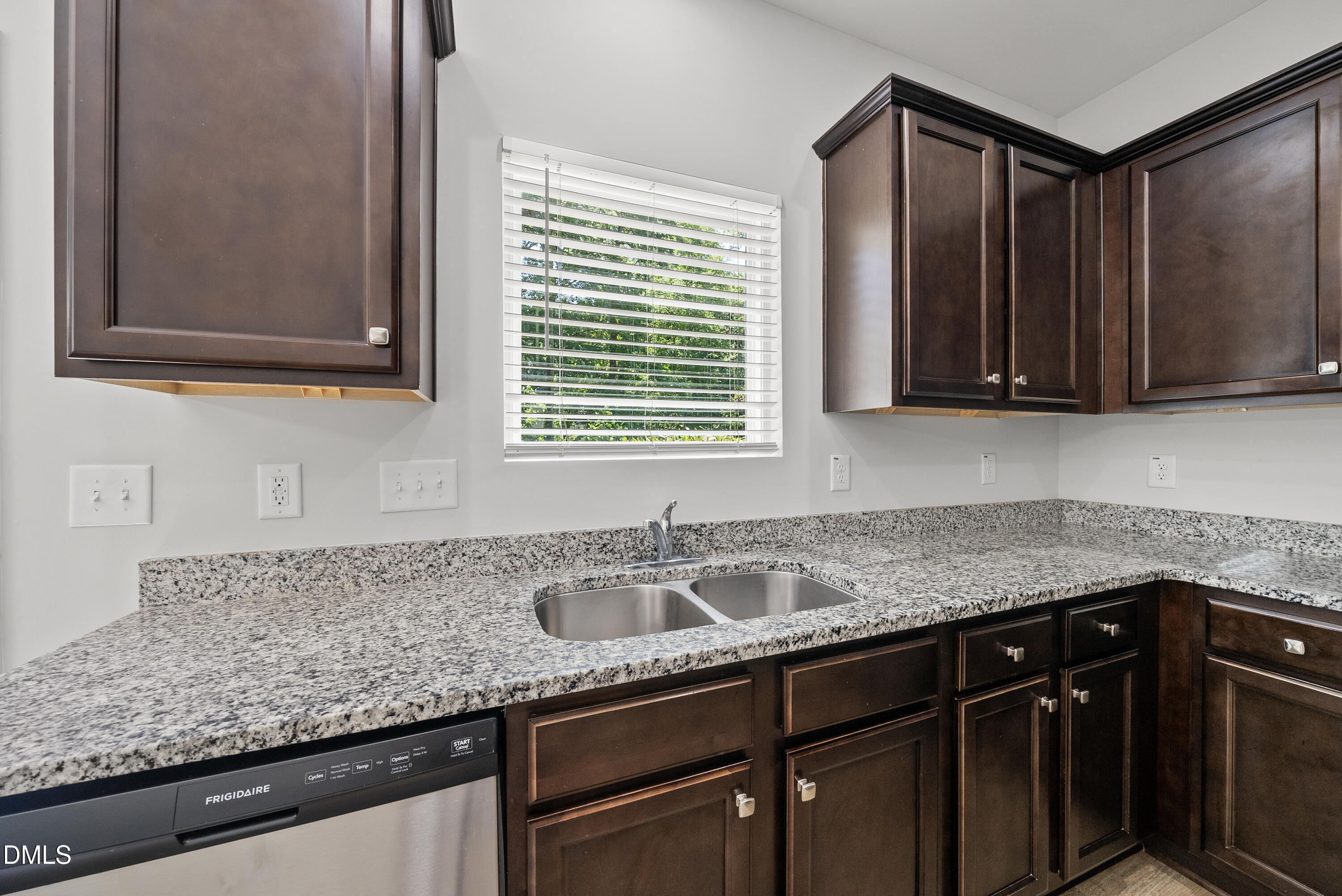 2816 Elsa Drive Raleigh, NC 27610 - Photo 17 of 35 a kitchen with granite countertop a sink and a window