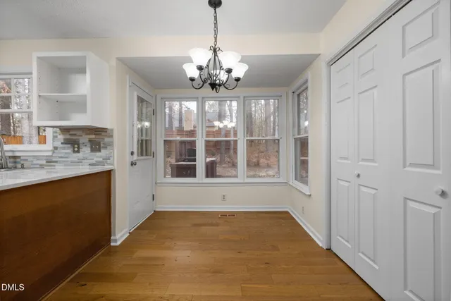 a view of an entryway with wooden floor
