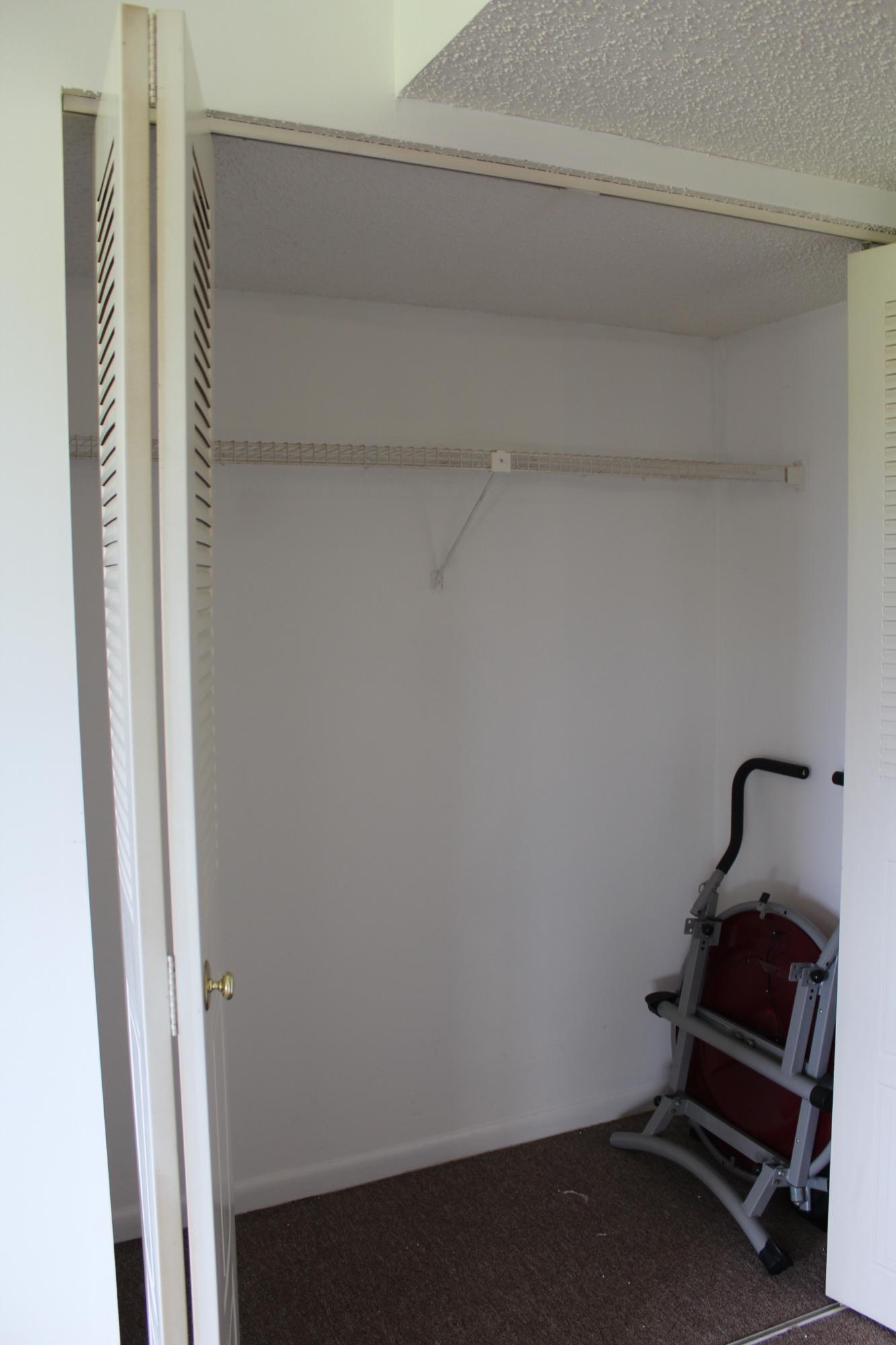 9235 Southwest 8th Street, Unit 503 Boca Raton, FL 33428 - Photo 20 of 27 a room with a bench