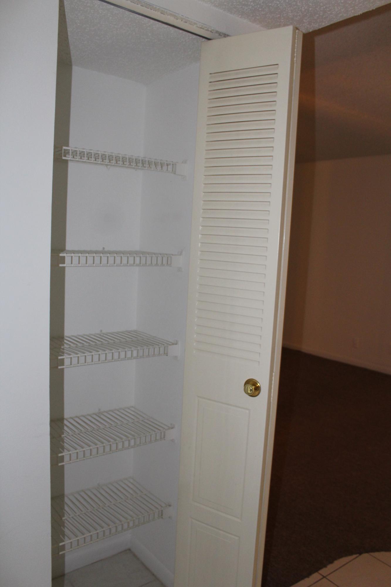 9235 Southwest 8th Street, Unit 503 Boca Raton, FL 33428 - Photo 21 of 27 a bathroom with a glass shower door