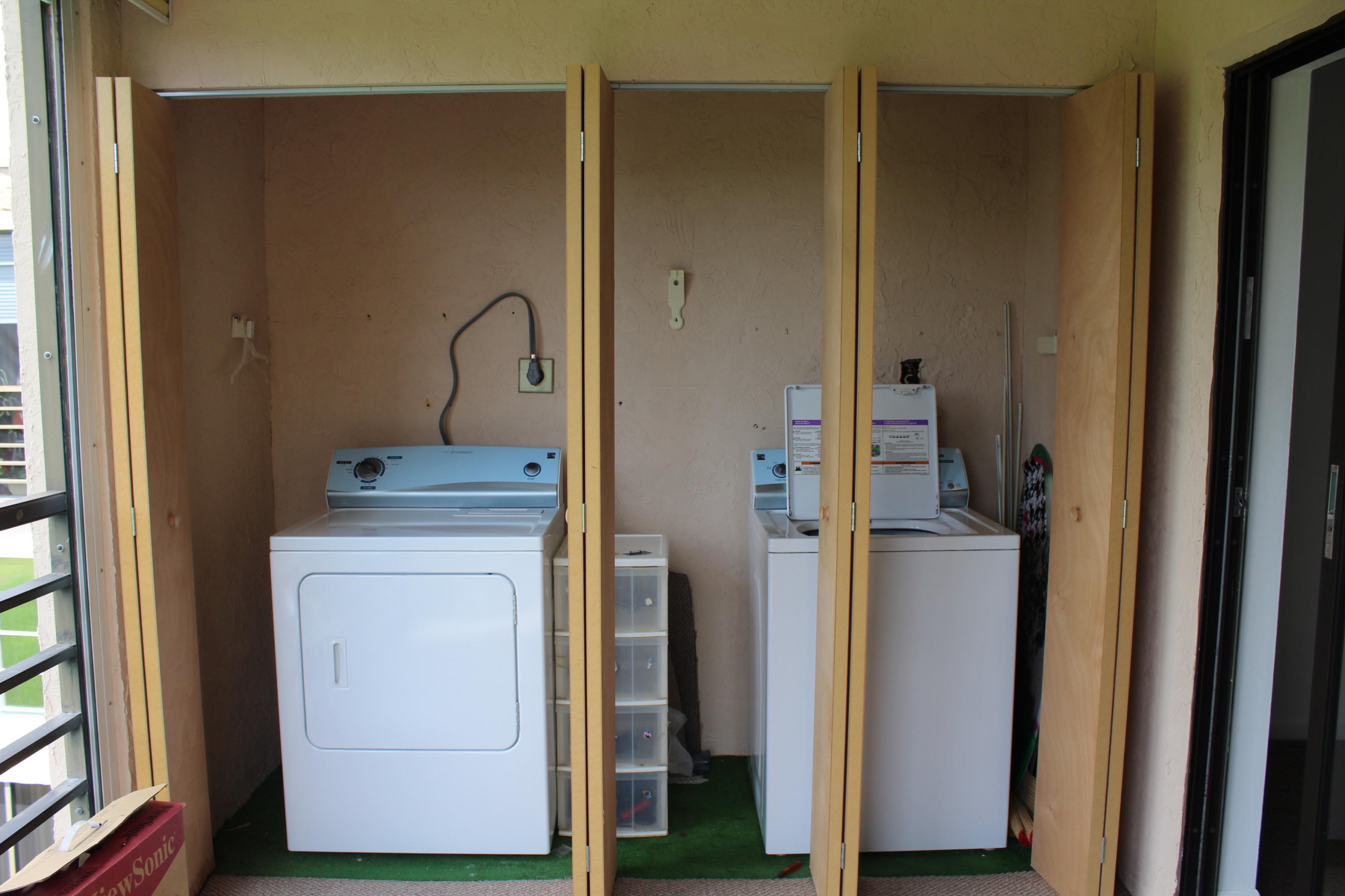 9235 Southwest 8th Street, Unit 503 Boca Raton, FL 33428 - Photo 23 of 27 a bathroom with a toilet and a sink