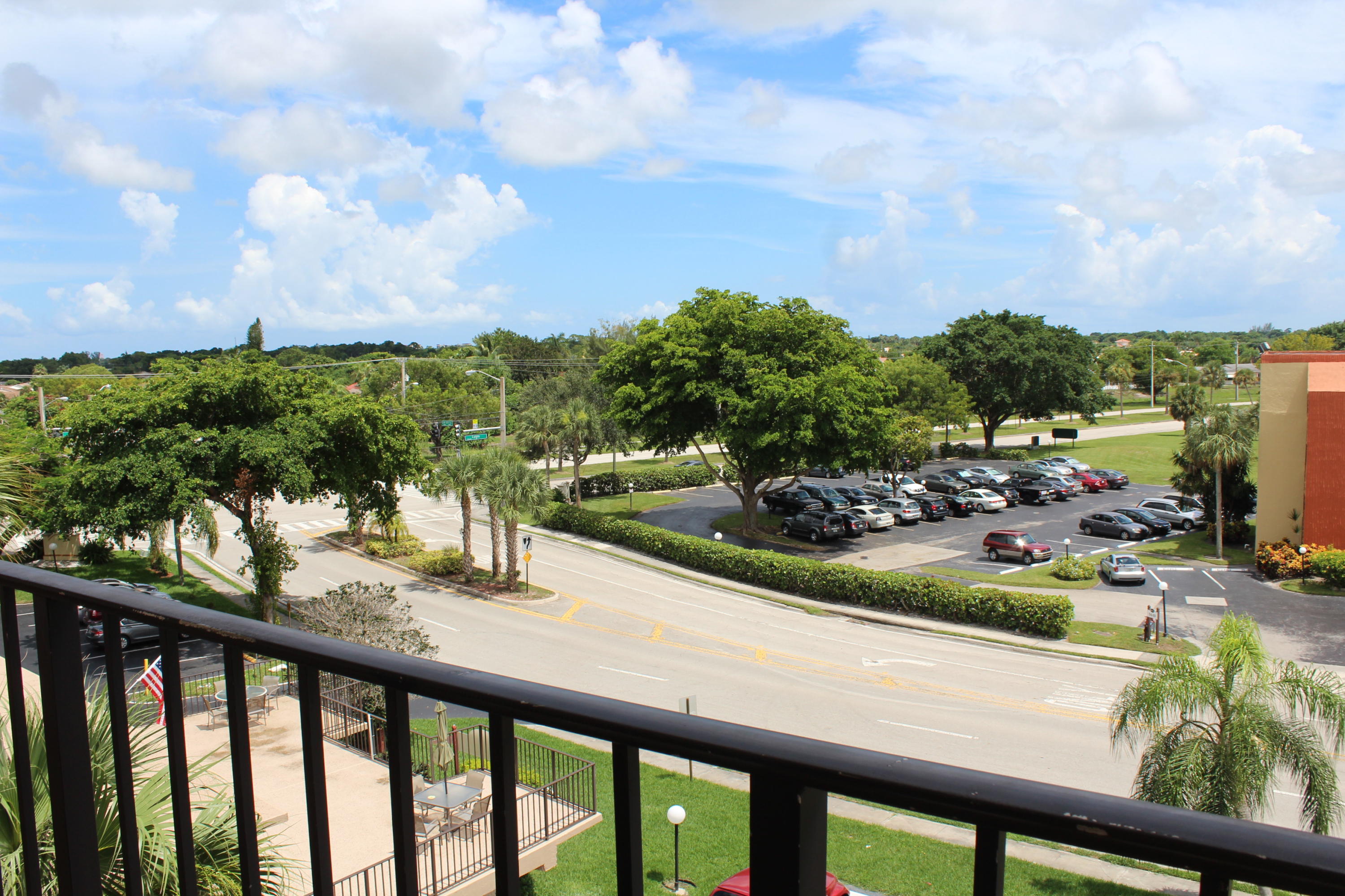 9235 Southwest 8th Street, Unit 503 Boca Raton, FL 33428 - Photo 26 of 27 a view of swimming pool from a balcony
