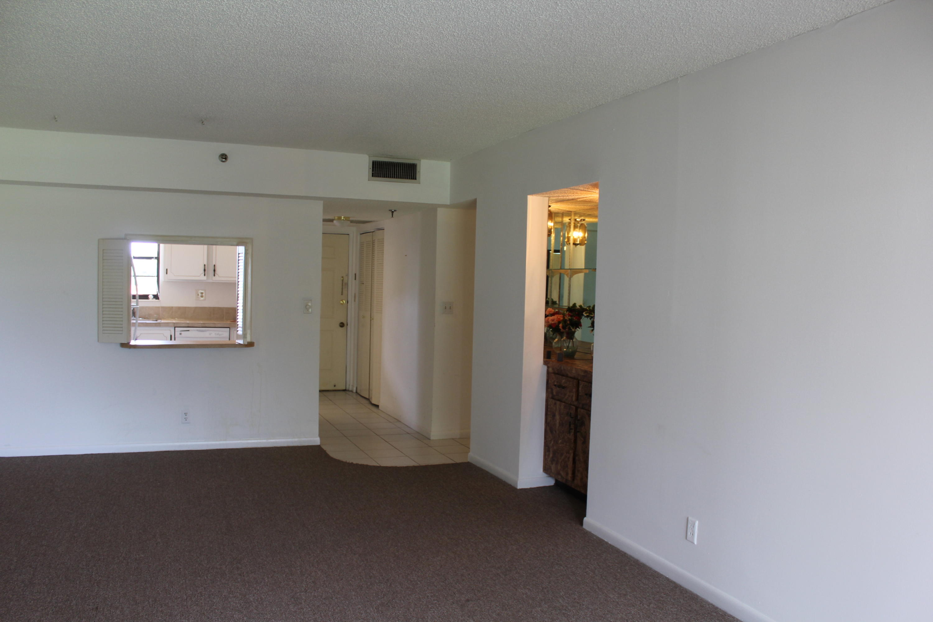 9235 Southwest 8th Street, Unit 503 Boca Raton, FL 33428 - Photo 8 of 27 an empty room with windows