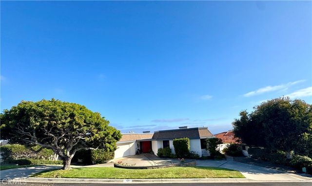 a view of houses with yard