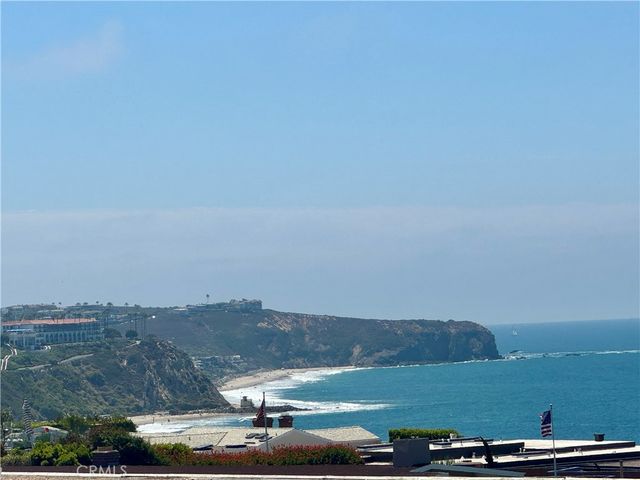 an aerial view of a residential houses with outdoor space