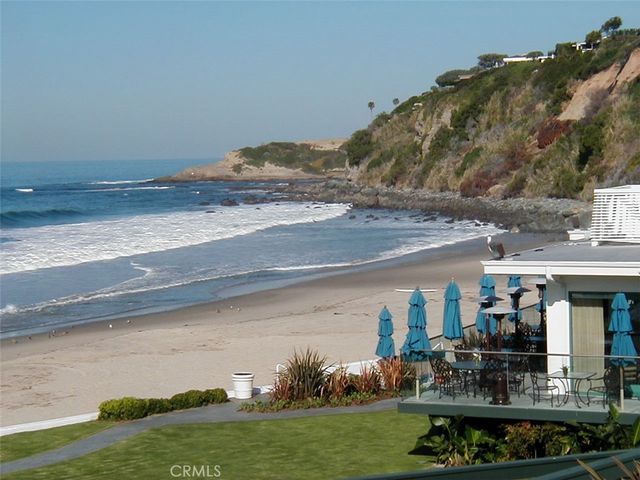 a view of a swimming pool and lounge chairs