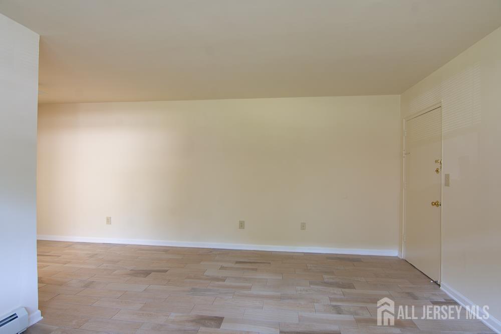 9 Koster Boulevard, Unit A Edison, NJ 08837 - Photo 2 of 15 a view of an empty room