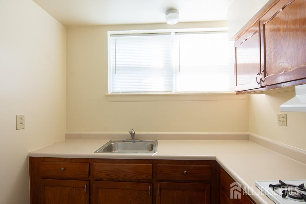 9 Koster Boulevard, Unit A Edison, NJ 08837 - Photo 6 of 15 a bathroom with a sink and a window
