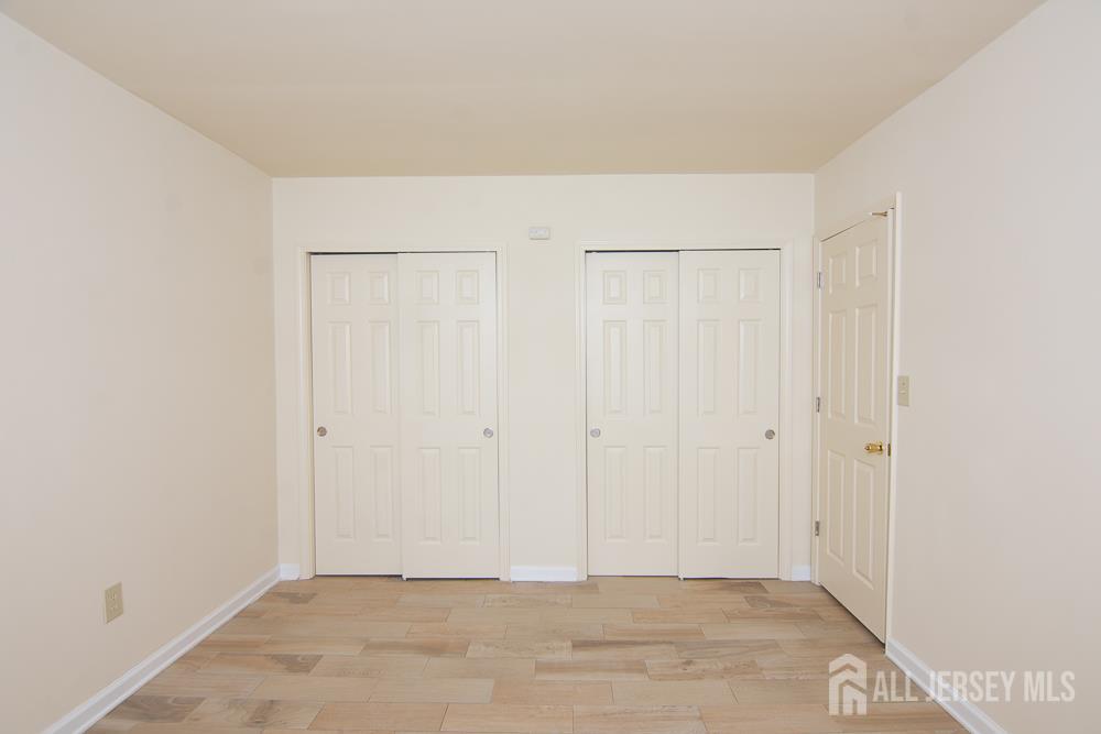 9 Koster Boulevard, Unit A Edison, NJ 08837 - Photo 9 of 15 a view of an empty room