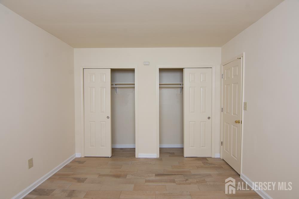9 Koster Boulevard, Unit A Edison, NJ 08837 - Photo 10 of 15 an empty room with closet