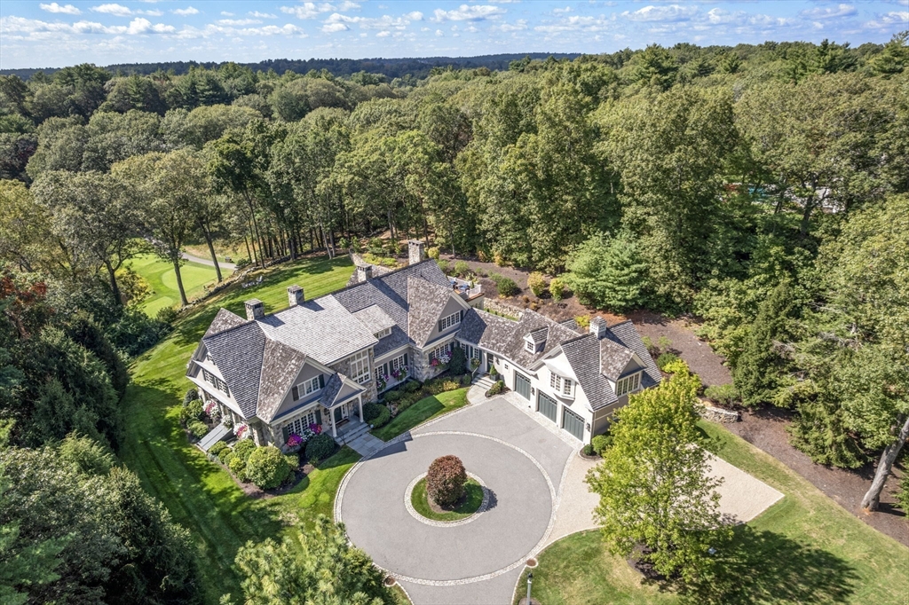 an aerial view of residential house with swimming pool