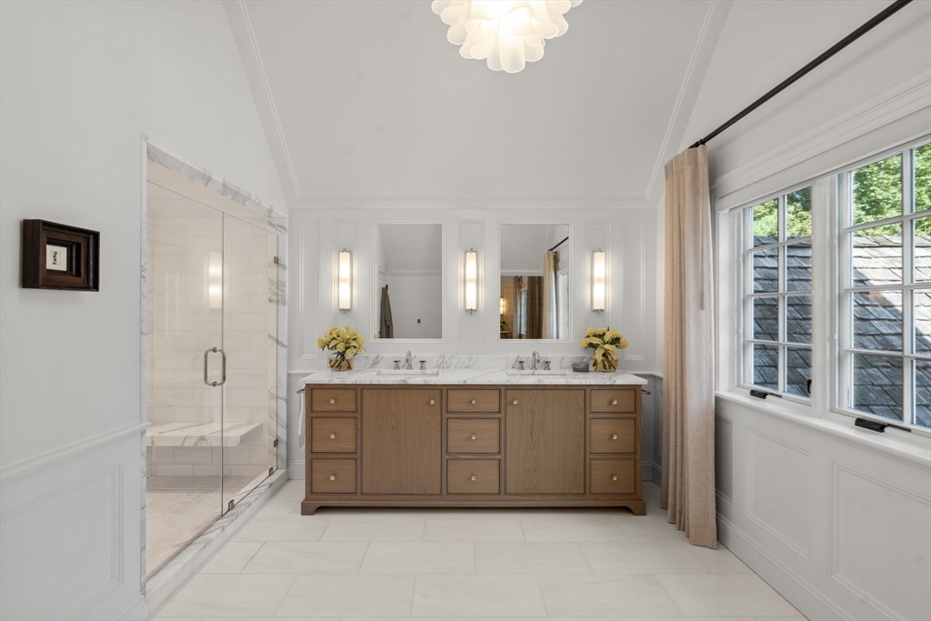 76 Robin Road Weston, MA 02493 - Photo 16 of 25 a spacious bathroom with a tub sink and mirror