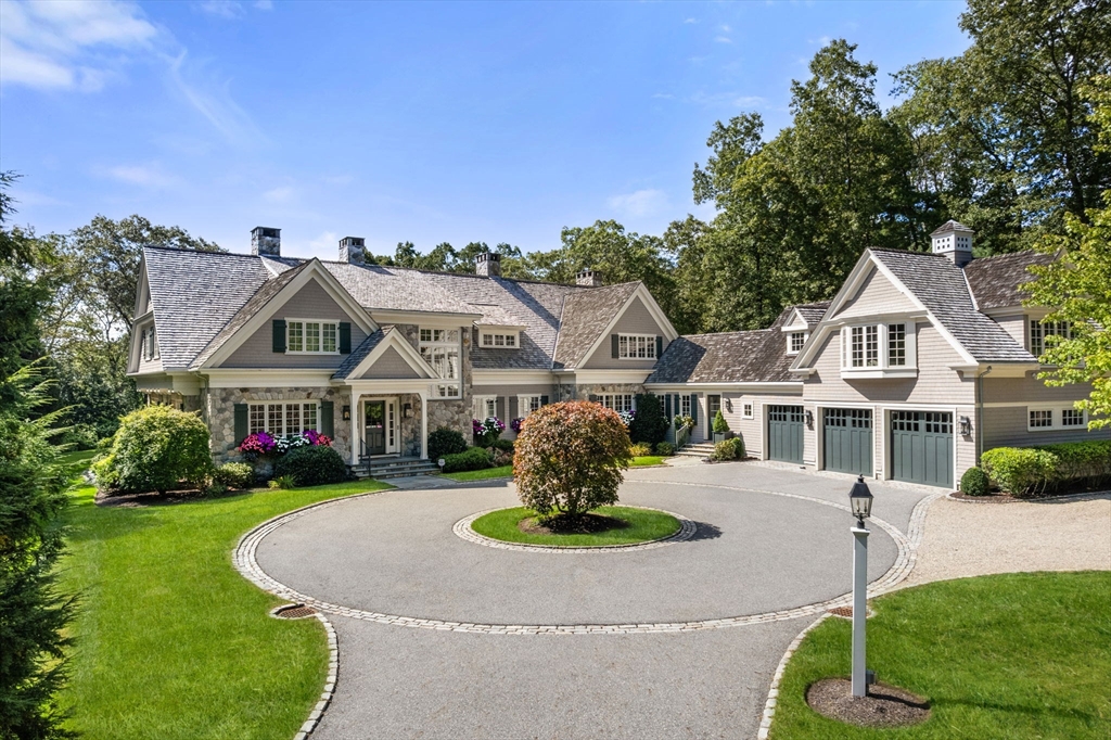 76 Robin Road Weston, MA 02493 - Photo 2 of 25 a front view of a house with a garden