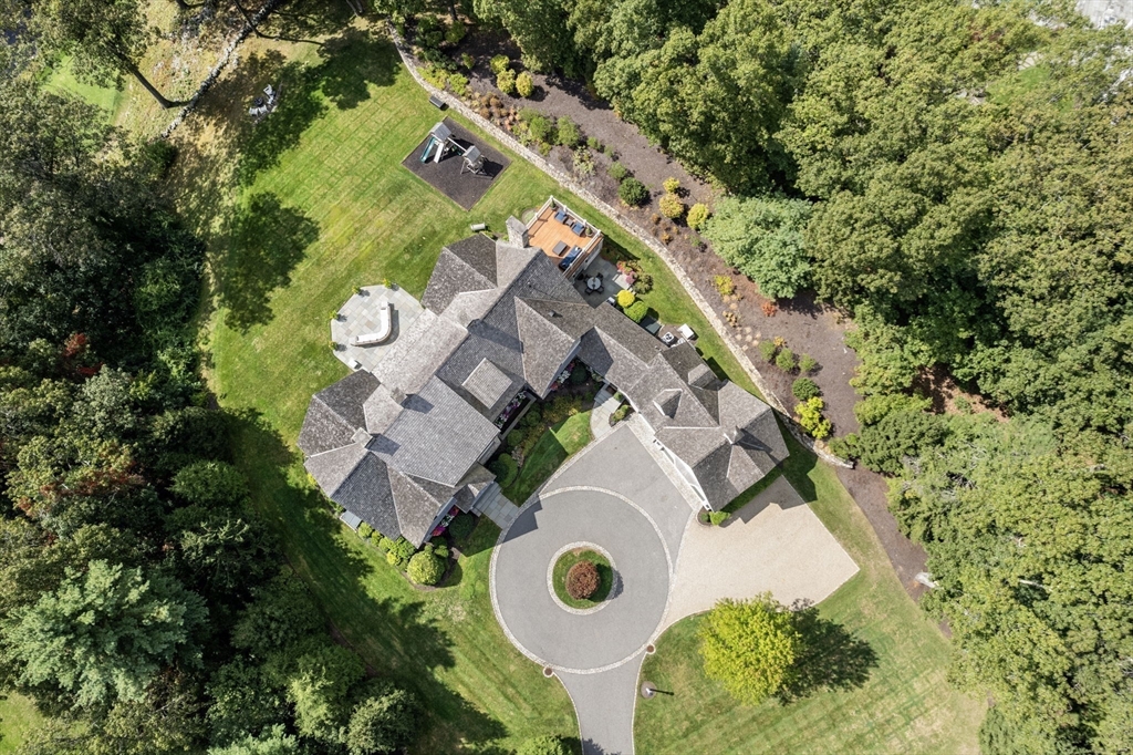 76 Robin Road Weston, MA 02493 - Photo 30 of 32 an aerial view of a house with a swimming pool and outdoor space