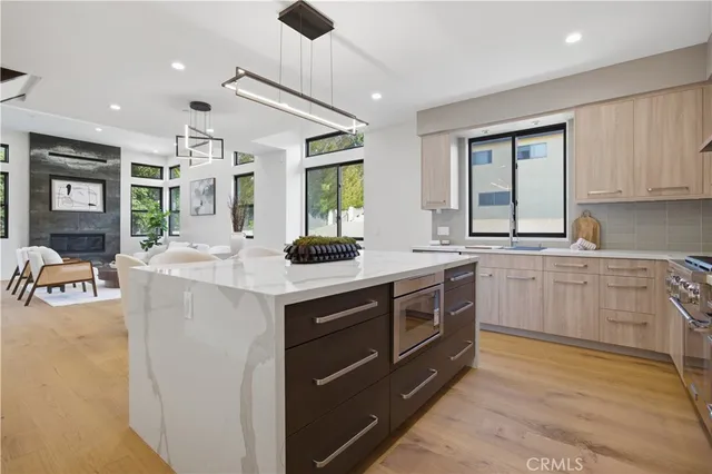 a kitchen with stainless steel appliances granite countertop a sink and cabinets