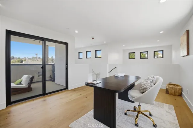 a bathroom with a toilet a sink a mirror a bathtub and vanity