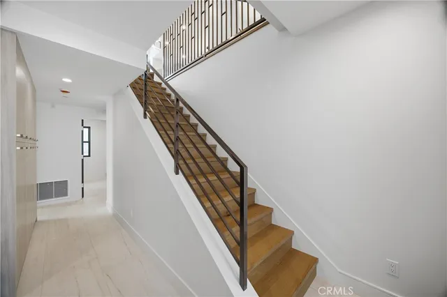 a view of kitchen cabinets a window and appliances