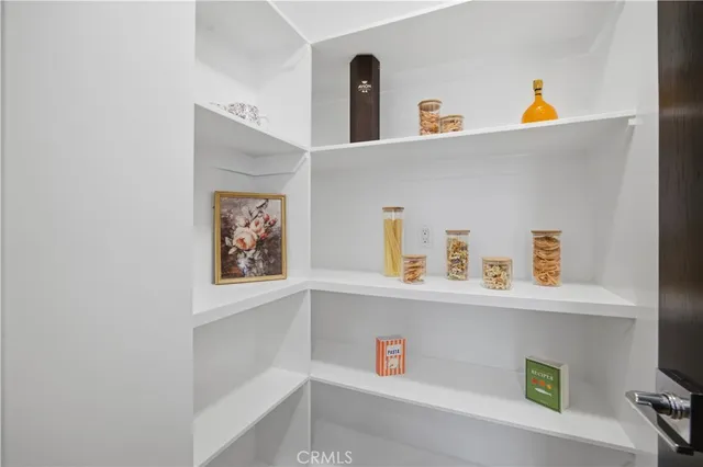 a bathroom with a double vanity sink mirror and toilet