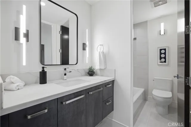 a bathroom with a shower and toilet