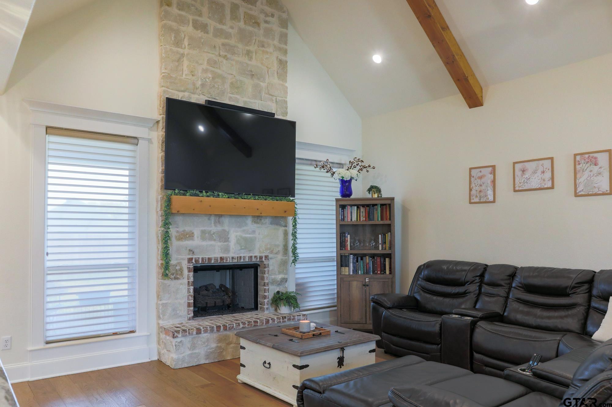 9065 Shallow Cove Tyler, TX 75703 - Photo 12 of 40 a living room with furniture and a fireplace