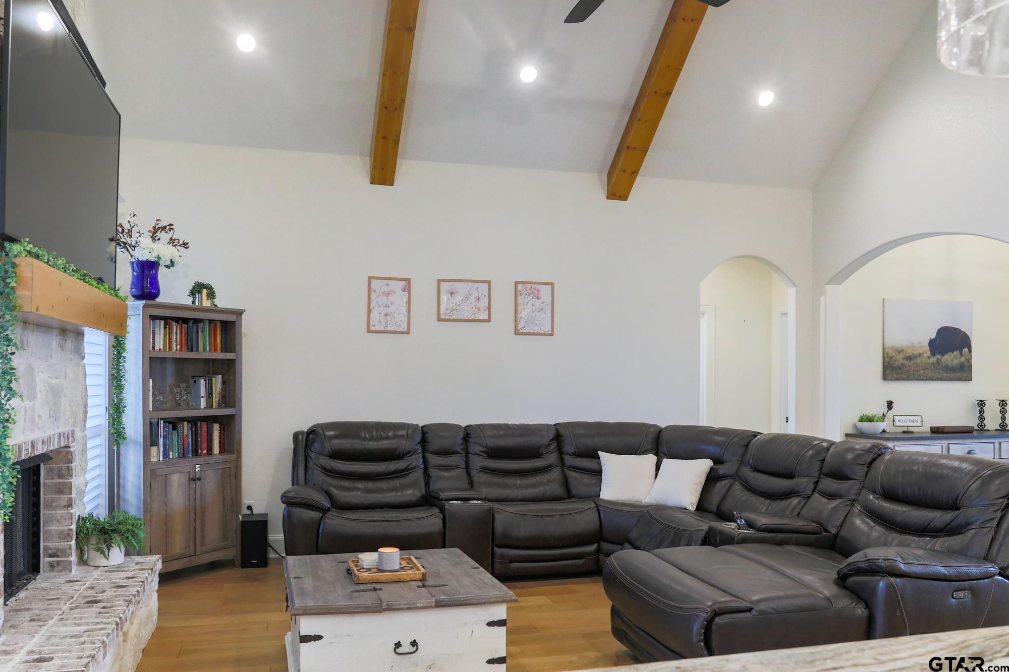 9065 Shallow Cove Tyler, TX 75703 - Photo 14 of 40 a living room with furniture and a book shelf