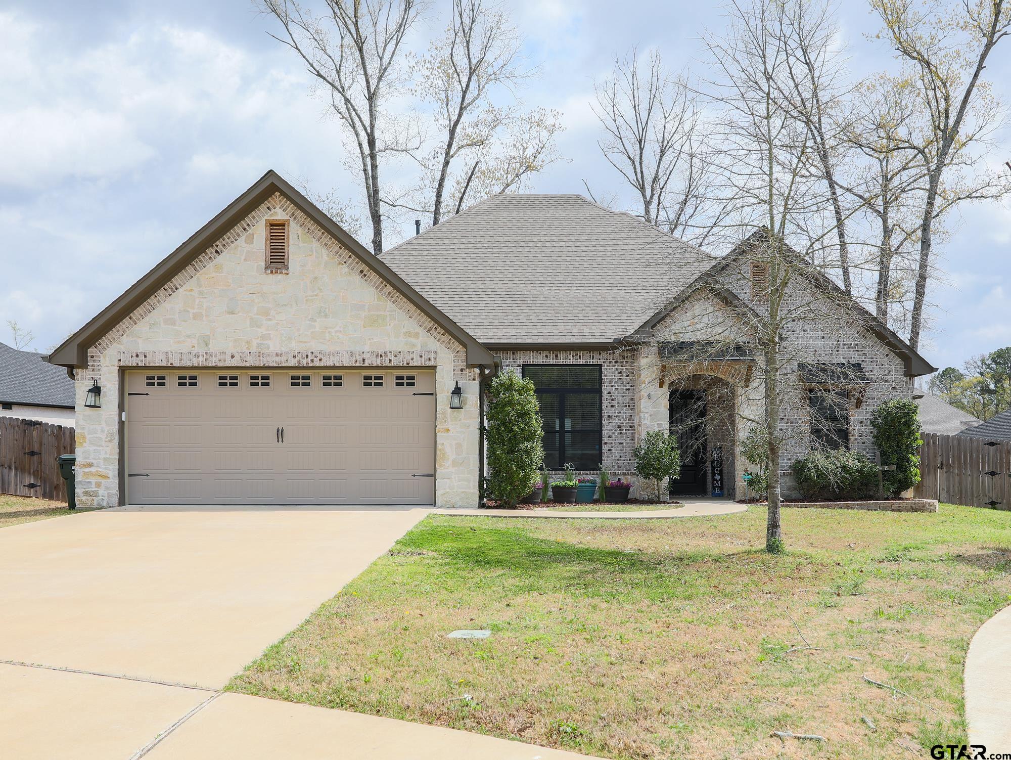 9065 Shallow Cove Tyler, TX 75703 - Photo 2 of 40 a view of a house with a yard