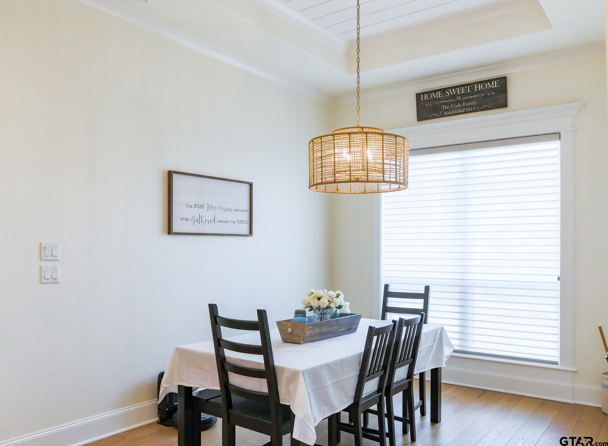 9065 Shallow Cove Tyler, TX 75703 - Photo 21 of 40 a view of a dining room with furniture and chandelier
