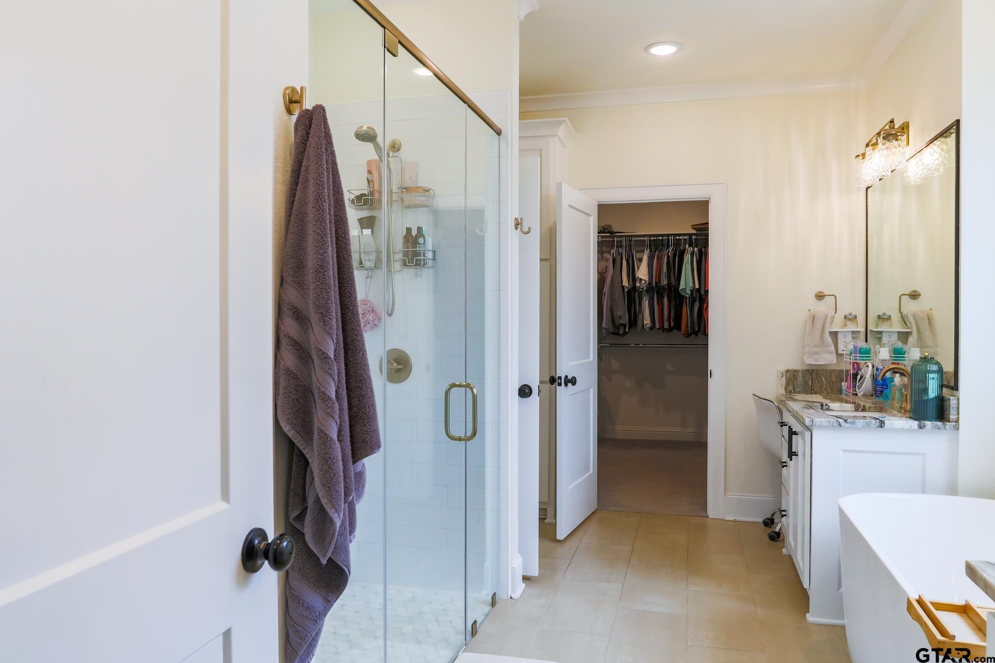 9065 Shallow Cove Tyler, TX 75703 - Photo 27 of 40 a view of a bathroom with tub and shower