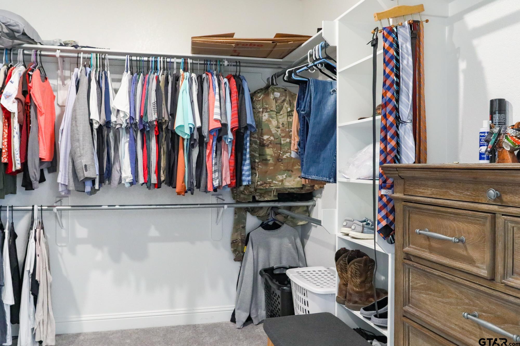 9065 Shallow Cove Tyler, TX 75703 - Photo 29 of 40 a view of walk in closet with clothes and shoes