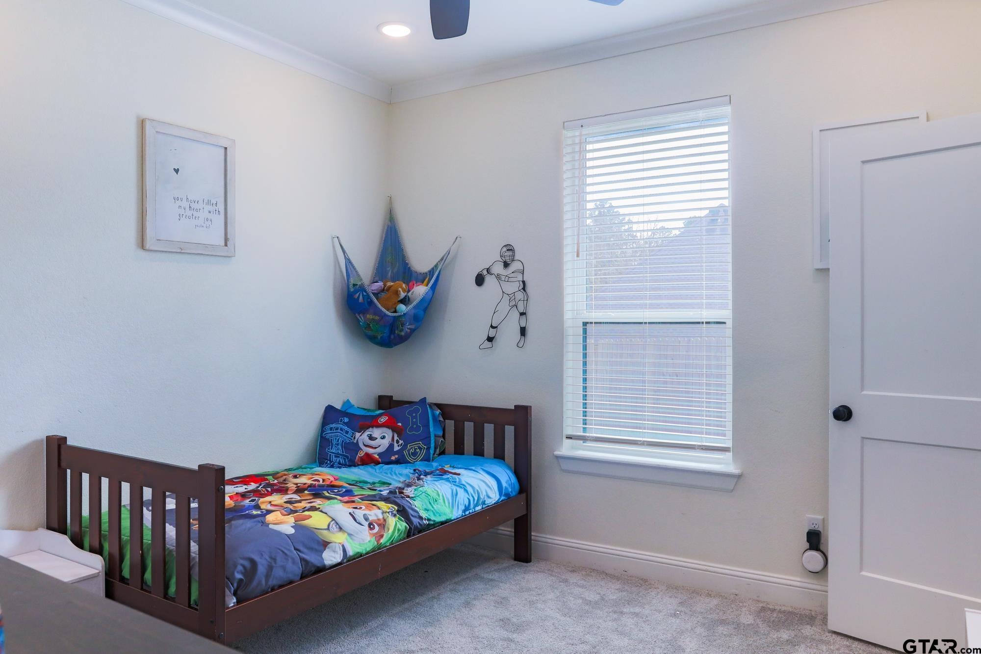 9065 Shallow Cove Tyler, TX 75703 - Photo 30 of 40 a bedroom with baby bed toys and a window