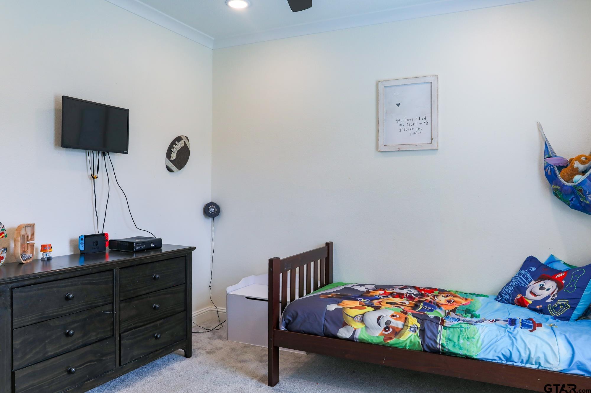 9065 Shallow Cove Tyler, TX 75703 - Photo 31 of 40 a bedroom with a bed and wooden floor