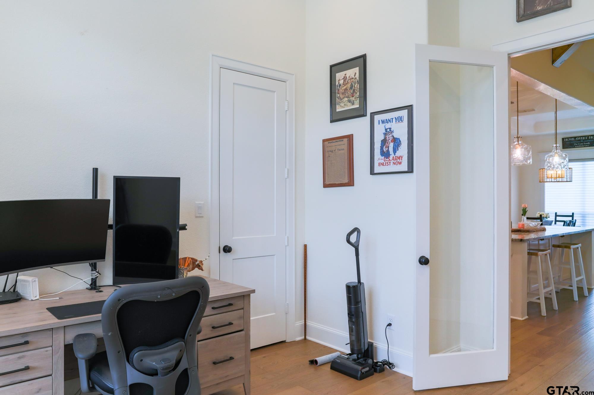 9065 Shallow Cove Tyler, TX 75703 - Photo 10 of 40 a view of a workspace with furniture and a flat screen tv