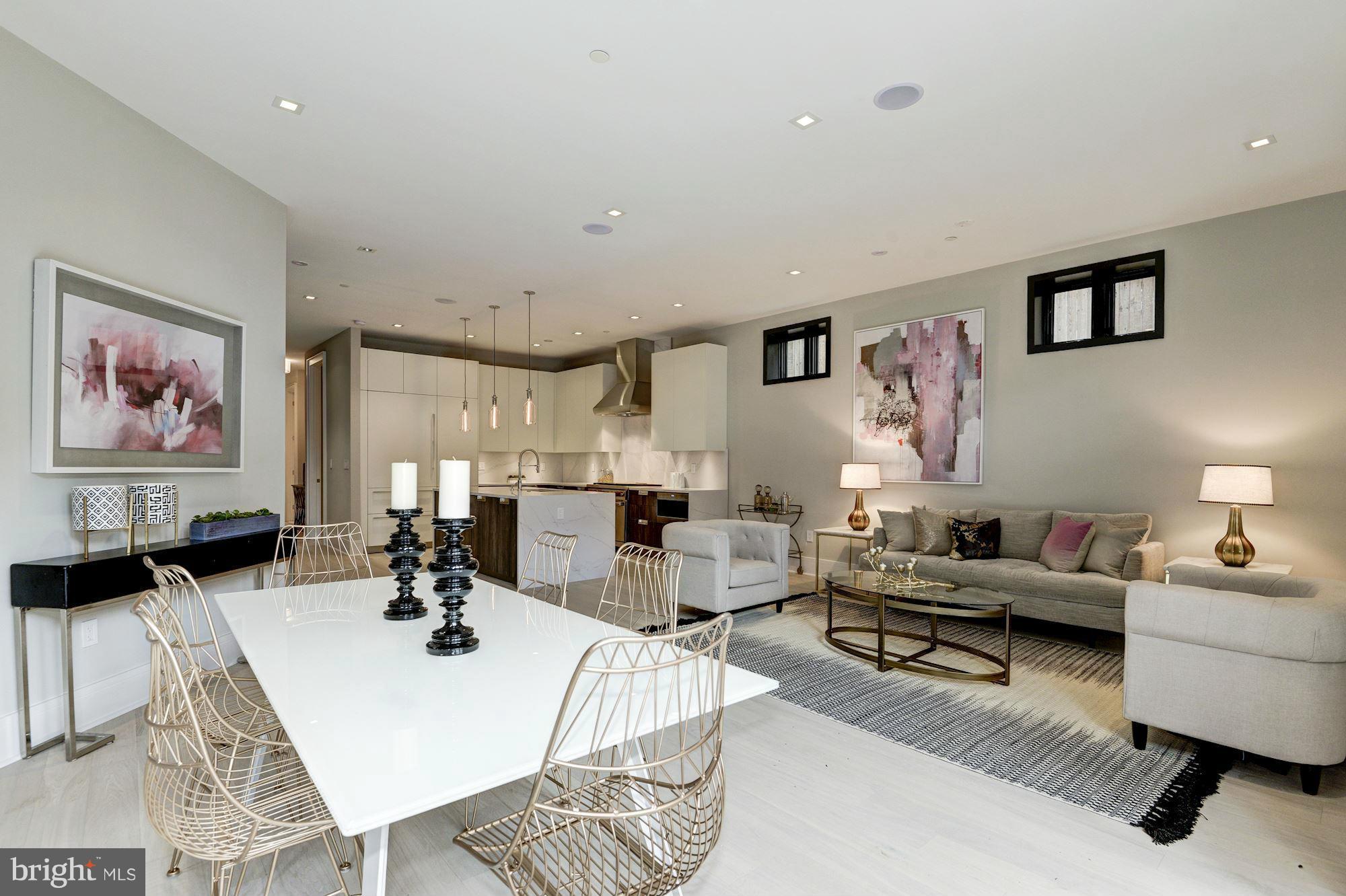1310 Q Street Northwest, Unit 4 Washington, DC 20009 - Photo 2 of 16 a living room with furniture or couch and a dining table