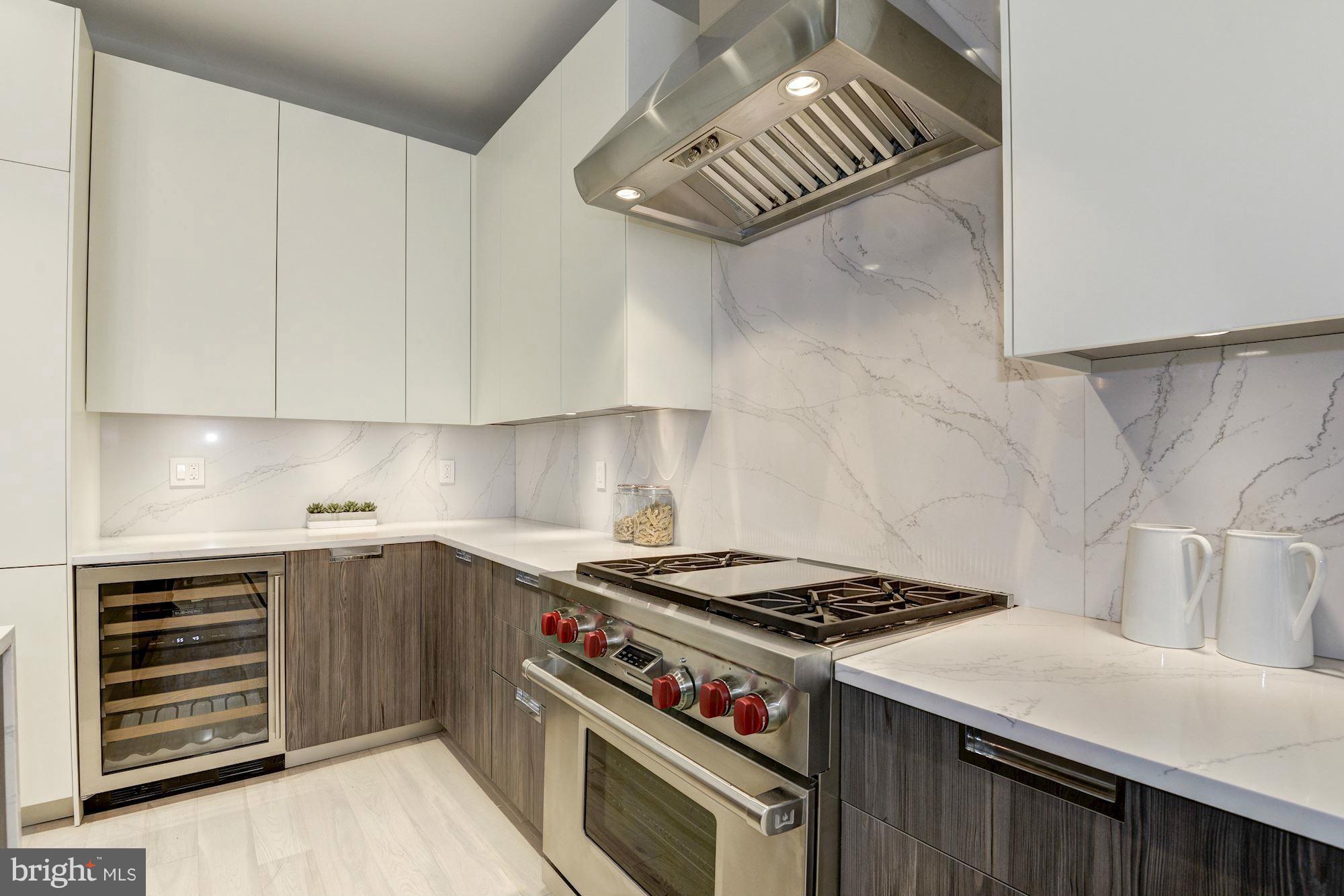 1310 Q Street Northwest, Unit 4 Washington, DC 20009 - Photo 3 of 16 a kitchen with a stove and a sink