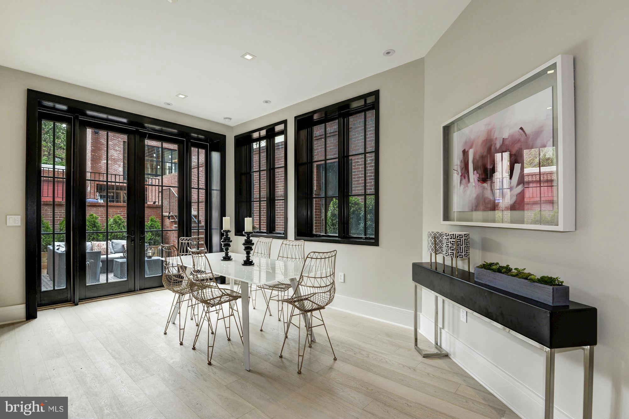 1310 Q Street Northwest, Unit 4 Washington, DC 20009 - Photo 5 of 16 a dining room with furniture and large window