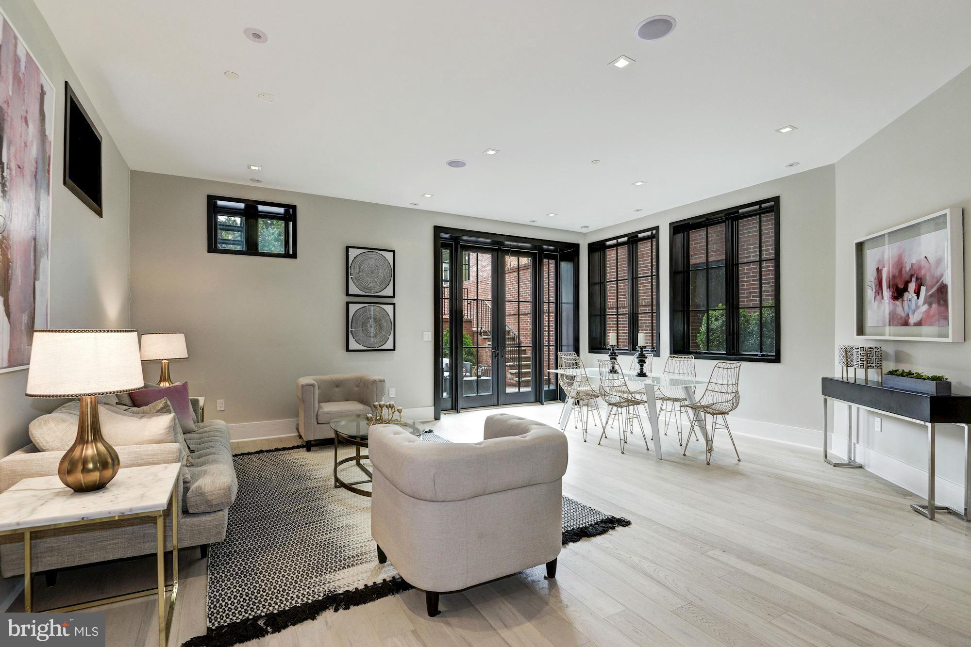 1310 Q Street Northwest, Unit 4 Washington, DC 20009 - Photo 6 of 16 a living room with furniture and a large window