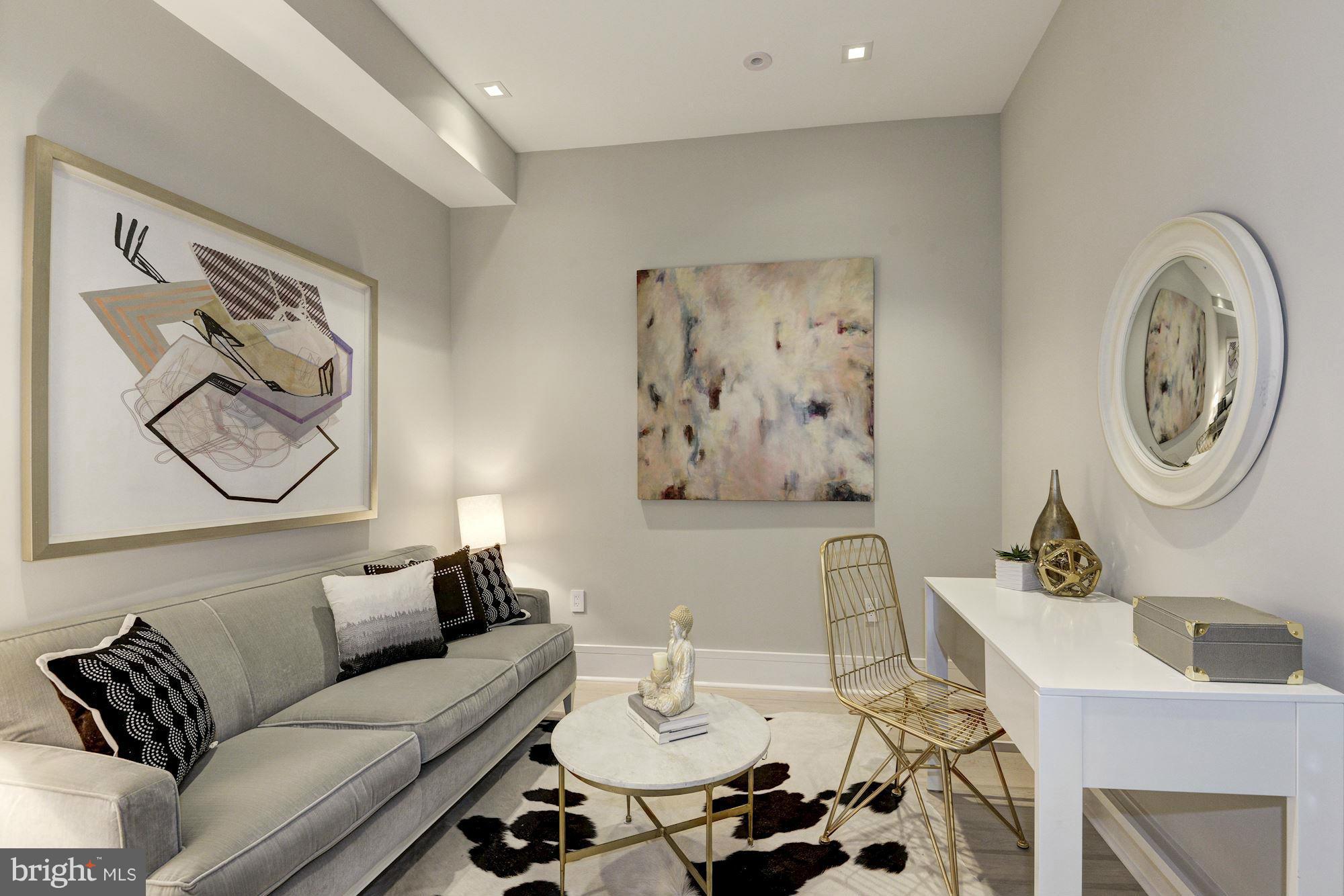 1310 Q Street Northwest, Unit 4 Washington, DC 20009 - Photo 7 of 16 a living room with furniture and a table