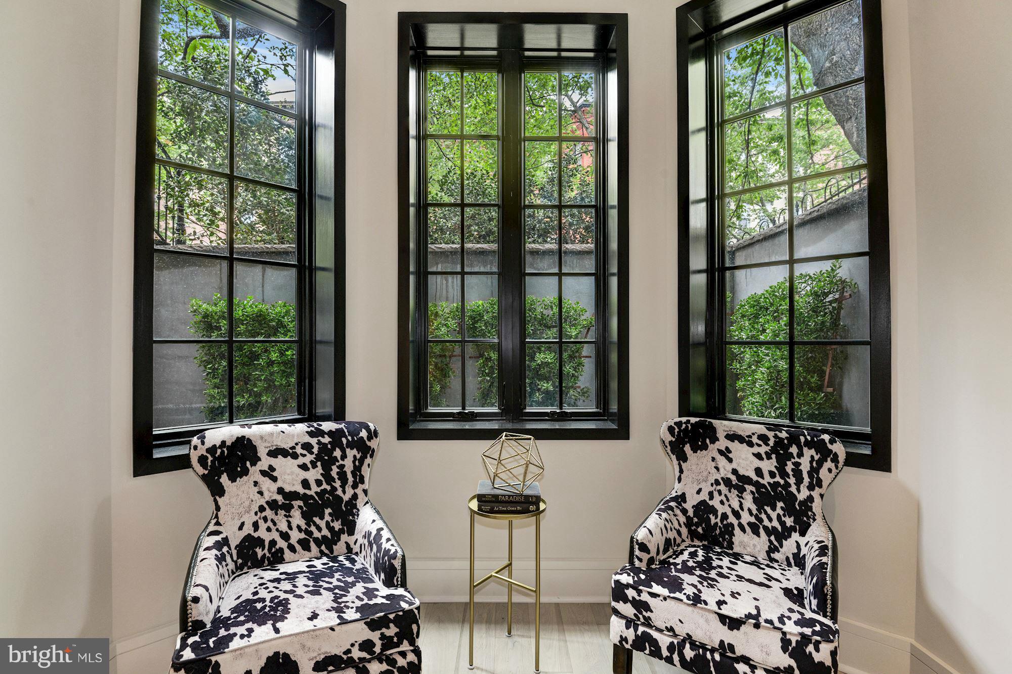 1310 Q Street Northwest, Unit 4 Washington, DC 20009 - Photo 9 of 16 a bed sitting in a bedroom next to a window