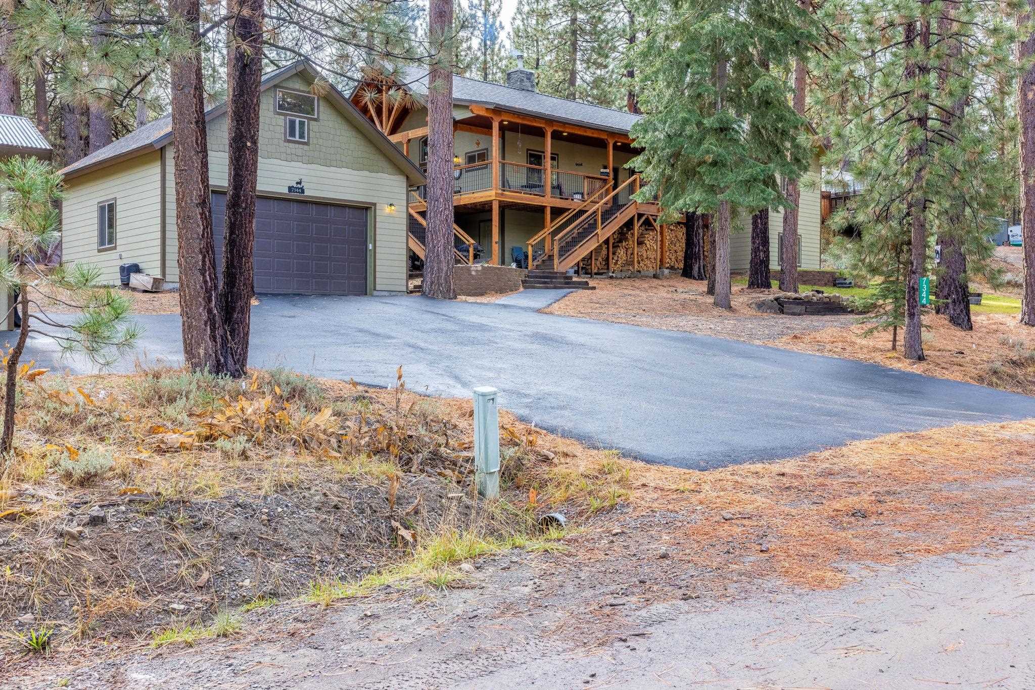 7344 Davis Way Portola, CA 96122 - Photo 1 of 21 a view of a house with a yard covered in snow