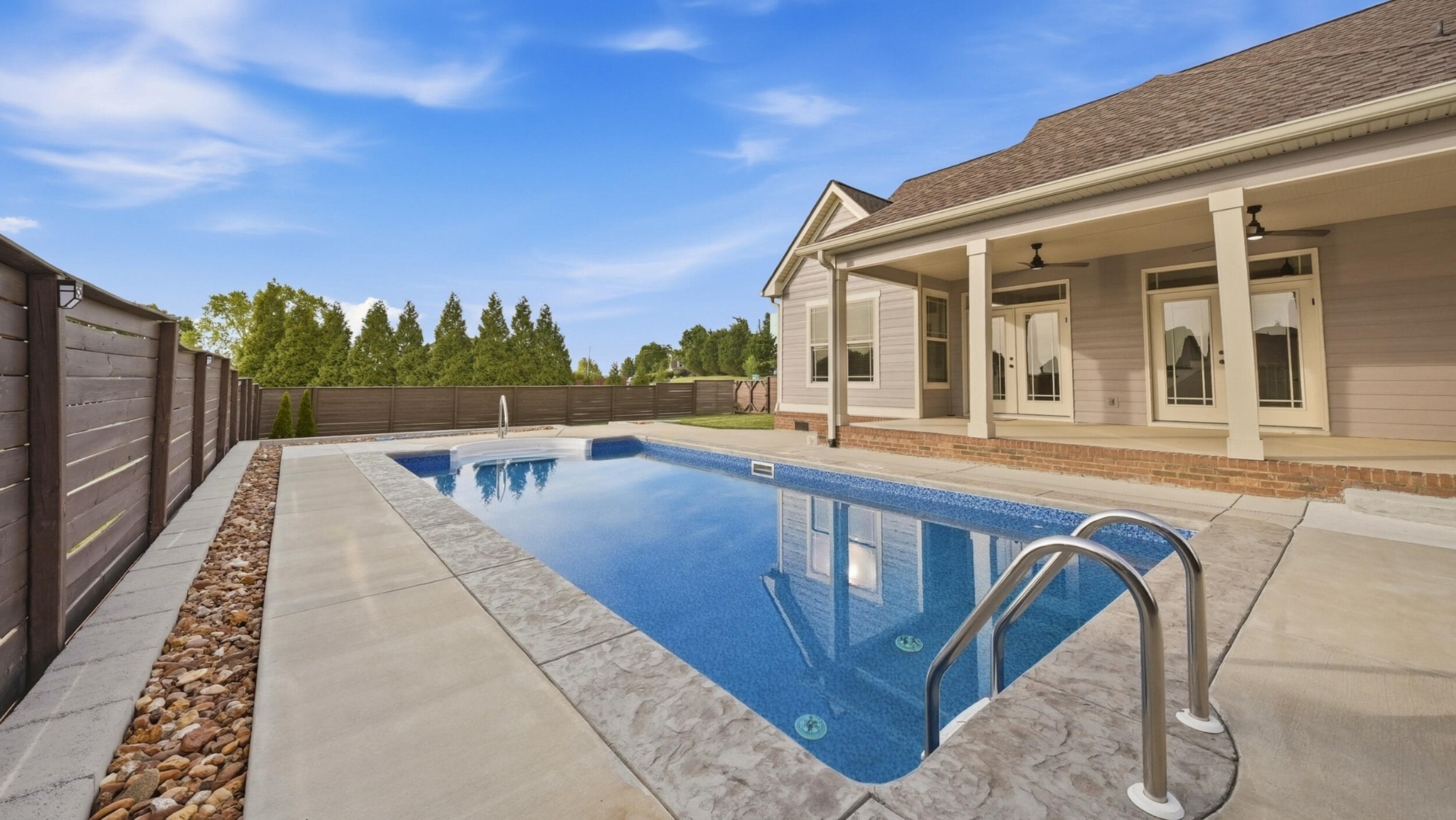 4046 Brock Road Chattanooga, TN 37421 - Photo 14 of 59 a view of a patio with table and chairs with wooden floor and fence