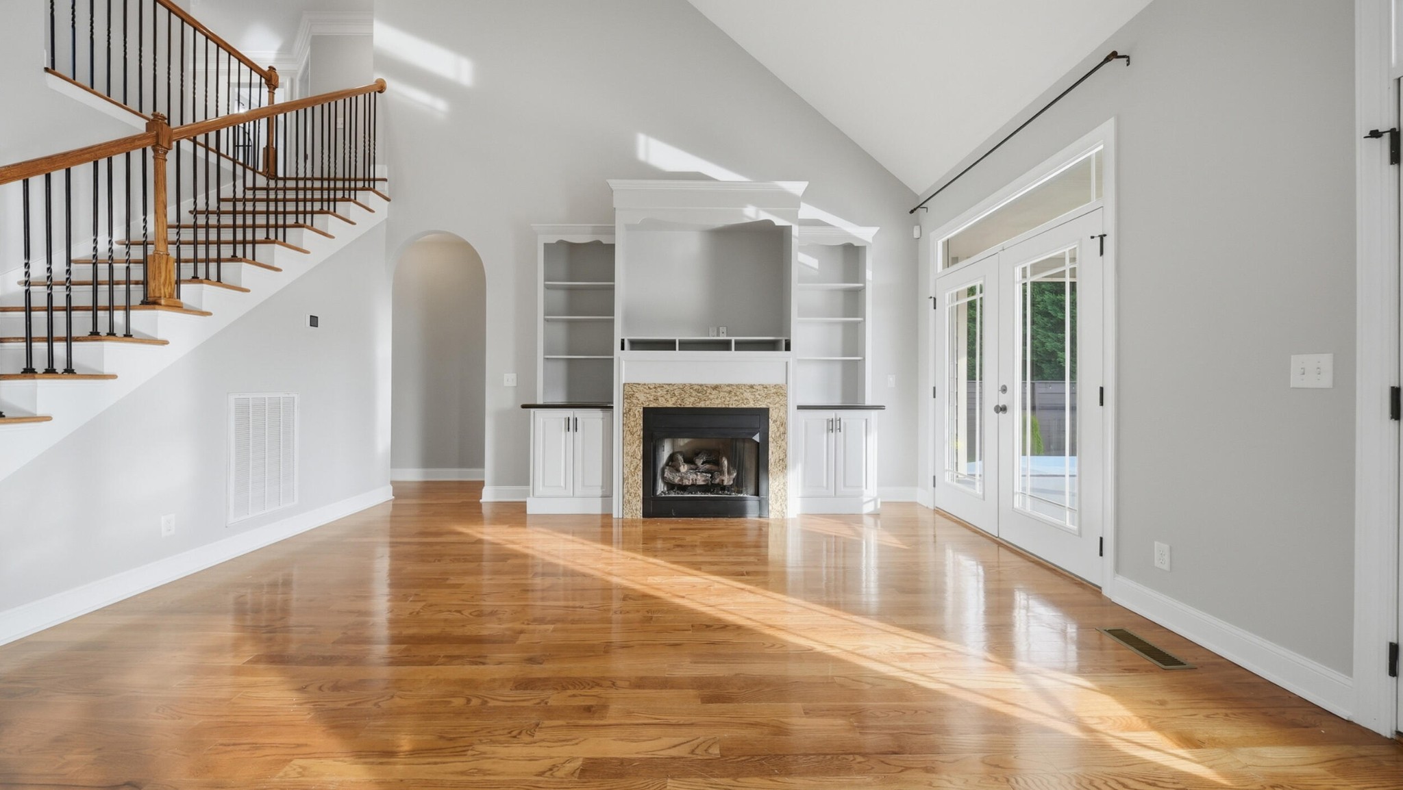4046 Brock Road Chattanooga, TN 37421 - Photo 19 of 59 a view of a livingroom with wooden floor and a fireplace